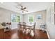 Inviting dining area featuring hardwood floors, ample lighting, and comfortable seating for Gathering meals at 3914 W Cleveland St, Tampa, FL 33609