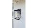 A stylish, updated exterior light fixture against a textured wall at 3914 W Cleveland St, Tampa, FL 33609