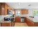 Well-equipped kitchen featuring stainless steel appliances, granite countertops, and ample cabinet space at 3914 W Cleveland St, Tampa, FL 33609