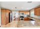 Modern kitchen with stainless steel appliances, granite countertops, and an open layout at 3914 W Cleveland St, Tampa, FL 33609