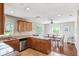 Open-concept kitchen with granite countertops, stainless steel appliances, and adjacent dining area at 3914 W Cleveland St, Tampa, FL 33609