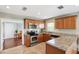 Updated kitchen boasting granite counters, stainless appliances, and seamless flow to living spaces at 3914 W Cleveland St, Tampa, FL 33609