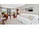 Spacious living room with hardwood floors, sliding glass doors, and comfortable seating arrangement at 3914 W Cleveland St, Tampa, FL 33609