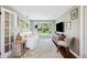 Cozy living room with hardwood floors, plush couch, and sliding glass doors leading to the outside at 3914 W Cleveland St, Tampa, FL 33609