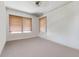 An empty bedroom with neutral colors offers 2 windows and carpeted floors at 4100 1St S Ave, St Petersburg, FL 33711