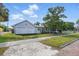 View of the front of the home, with a two car garage and fenced yard at 4100 1St S Ave, St Petersburg, FL 33711