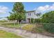 Charming two-story home with a fenced yard and mature trees at 4100 1St S Ave, St Petersburg, FL 33711