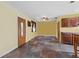 Spacious eat in kitchen featuring tile floors, wood cabinets, breakfast bar, and exterior door at 4100 1St S Ave, St Petersburg, FL 33711