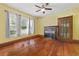 Bright living room with hardwood floors, fireplace, ceiling fan, large windows and classic trim at 4100 1St S Ave, St Petersburg, FL 33711