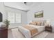 Relaxing bedroom with neutral tones, carpet, large window, and tastefully coordinated decor at 4100 1St S Ave, St Petersburg, FL 33711