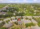 Birds eye view of a townhouse with green surroundings, showing close proximity to roads with an exact location marker at 4105 Bismarck Palm Dr, Tampa, FL 33610