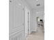 Hallway leads to an office with a desk and a view of the backyard, providing privacy at 4105 Bismarck Palm Dr, Tampa, FL 33610
