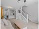 Spacious living room featuring staircase, open floor plan, and plenty of natural light at 4105 Bismarck Palm Dr, Tampa, FL 33610
