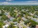 Aerial view highlighting the property's location within a residential area, showcasing nearby city skyline at 4124 W San Juan St, Tampa, FL 33629