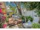 Inviting backyard featuring a spacious deck and patio surrounded by lush greenery and garden decor at 4124 W San Juan St, Tampa, FL 33629