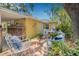 Backyard featuring deck with seating and lush landscaping, offering a serene outdoor retreat at 4124 W San Juan St, Tampa, FL 33629