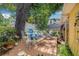 Charming backyard deck with outdoor seating amidst lush greenery, creating a serene retreat at 4124 W San Juan St, Tampa, FL 33629