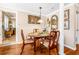 Bright dining room with a hardwood floors, and ornate wooden chairs at 4124 W San Juan St, Tampa, FL 33629