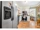 View of the kitchen featuring a stainless steel refrigerator, appliances, and tile flooring at 4124 W San Juan St, Tampa, FL 33629