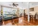 Bright living room featuring a hardwood floors, a ceiling fan, and an open floor plan at 4124 W San Juan St, Tampa, FL 33629