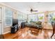 Inviting living room with hardwood floors, a ceiling fan, and lots of natural light at 4124 W San Juan St, Tampa, FL 33629