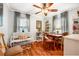 Comfortable living room featuring hardwood flooring, a ceiling fan, and plenty of natural light at 4124 W San Juan St, Tampa, FL 33629