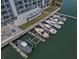 Stunning aerial view of condo complex with boat docks on the water at 415 Island Way # 511, Clearwater Beach, FL 33767