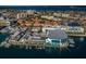 Aerial view of Clearwater Marine Aquarium with waterfront, marina, and city skyline at 415 Island Way # 511, Clearwater Beach, FL 33767