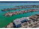Gorgeous aerial view of a condo complex in a waterfront community with private boat docks and pristine waterways at 415 Island Way # 511, Clearwater Beach, FL 33767