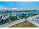 A beautiful view of a dock on the water with several boats, perfect for enjoying waterfront activities at 415 Island Way # 511, Clearwater Beach, FL 33767