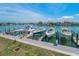 View of several boats docked along the water, showing the luxurious boating lifestyle available to homeowners at 415 Island Way # 511, Clearwater Beach, FL 33767