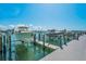 Boat dock on the water with boat lifts, offering waterfront living at 415 Island Way # 511, Clearwater Beach, FL 33767