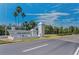Elegant community sign: Island Estates, welcomes residents and guests with tropical landscaping and sunny skies at 415 Island Way # 511, Clearwater Beach, FL 33767