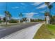 Welcome to Island Estates: a beautiful community showcasing lush landscaping and sunny skies at 415 Island Way # 511, Clearwater Beach, FL 33767