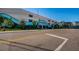 Parking garage with decorative accents, accessible entrance, and street view at 415 Island Way # 511, Clearwater Beach, FL 33767