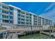 Condo complex featuring waterfront living, docks, and pool at 415 Island Way # 511, Clearwater Beach, FL 33767