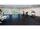 Community gym features fitness machines, rubber floors, and wall of large windows with neighborhood views at 415 Island Way # 511, Clearwater Beach, FL 33767