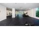 Bright gym with fitness equipment, black rubber flooring, white walls and columns, with natural light at 415 Island Way # 511, Clearwater Beach, FL 33767
