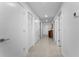 Bright hallway with storage, wood-look tile floors, and modern lighting at 415 Island Way # 511, Clearwater Beach, FL 33767