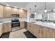 Modern kitchen featuring stainless steel appliances, light wood cabinets, and bright white countertops at 415 Island Way # 511, Clearwater Beach, FL 33767