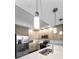 Bright and modern kitchen with stainless steel appliances and stylish pendant lighting at 415 Island Way # 511, Clearwater Beach, FL 33767