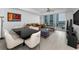 Open concept space with dining area, stylish furniture, and balcony access at 415 Island Way # 511, Clearwater Beach, FL 33767