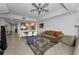 Open-concept living area boasts modern furnishings, a ceiling fan, and lots of space at 415 Island Way # 511, Clearwater Beach, FL 33767