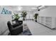 Modern condo lobby area with decorative plants and comfortable seating at 415 Island Way # 511, Clearwater Beach, FL 33767