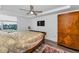Comfortable bedroom featuring modern ceiling fan and urban views from the window at 415 Island Way # 511, Clearwater Beach, FL 33767
