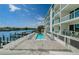 Outdoor pool with lounge chairs, bay views, water access and community outdoor space at 415 Island Way # 511, Clearwater Beach, FL 33767