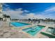Sparkling community pool and jacuzzi with resort-style lounging, beautiful landscaping and relaxing spa at 415 Island Way # 511, Clearwater Beach, FL 33767