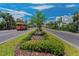 Charming street scene featuring the community trolley and picturesque landscaping under clear blue skies at 415 Island Way # 511, Clearwater Beach, FL 33767