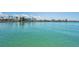 A calming waterfront scene, showing the open water and surrounding properties in a desirable waterfront community at 415 Island Way # 511, Clearwater Beach, FL 33767