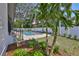 Backyard with a pool, small spa, fenced in perimeter, and fresh green lawn at 4224 W Corona St, Tampa, FL 33629